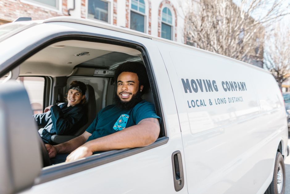 Friendly professional movers team smiling