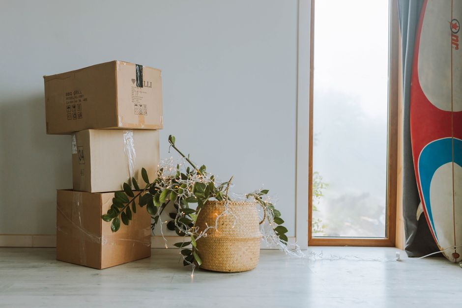 Unpacking boxes in a bright new living room